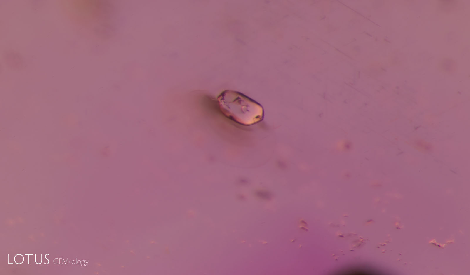 (Unheated) A transparent rounded zircon crystal in sample 4.