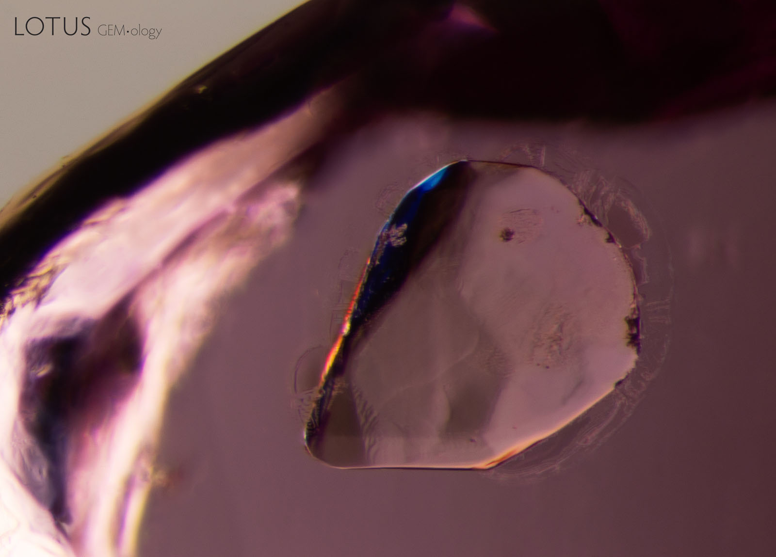 (1100°C) The first signs of change, with small fissures forming on the edges of the crystal. Subtle changes to the texture are also visible inside the crystal, which appears less smooth.