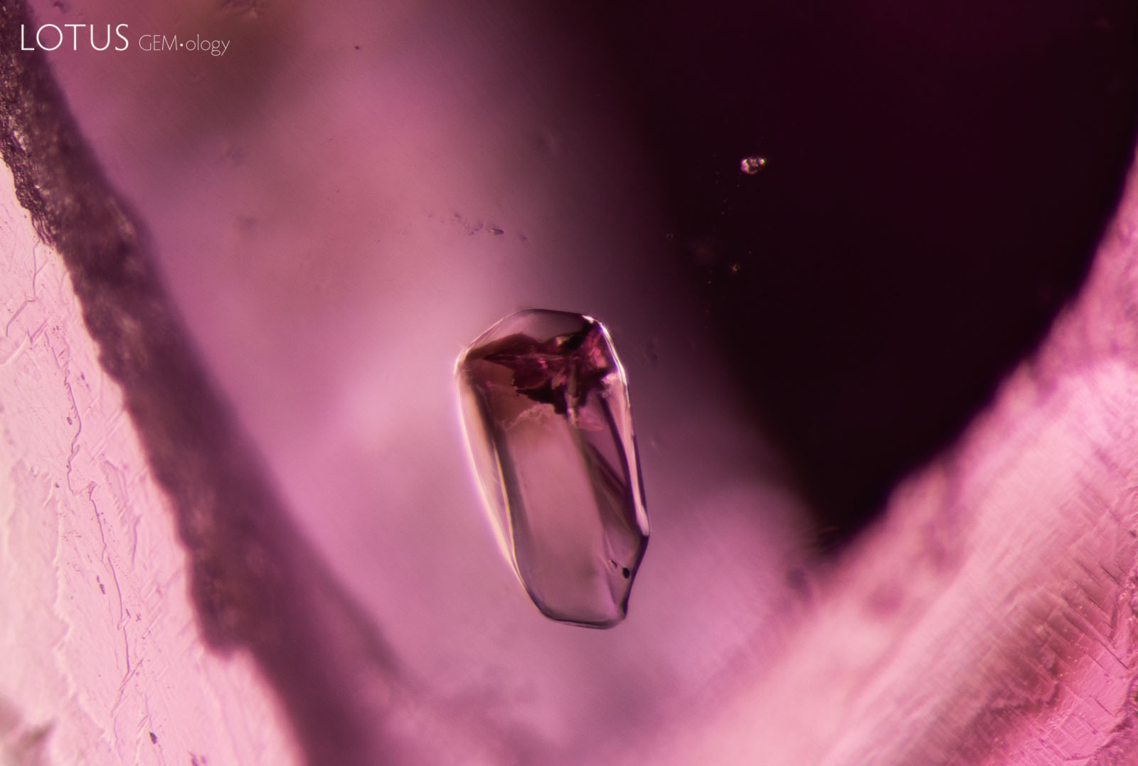 (Unheated) Sample 39 shows a spinel crystal in the center, with a small crystal to the top right.
