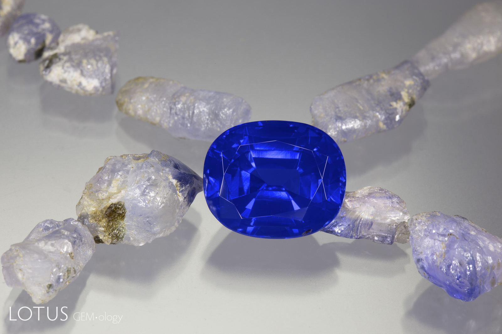 Is origin important? Yes, the rough sapphires do hail from India’s famous Kashmir mines. But the 14 ct cut stone is from Madagascar. What do you want? A poor quality sapphire from Kashmir or a magnificent blue beauty from Madagascar? As a friend of mine said long ago, only inclusion collectors should buy based on origin. Photo: Wimon Manorotkul. 