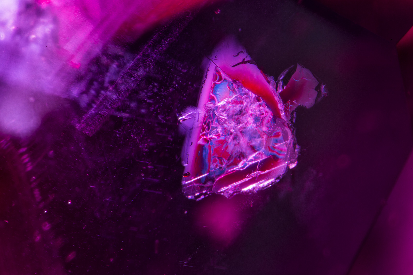 Another crystal of what appears to be mica in a ruby from the new Madagascar find. Photo: R.W. Hughes/Lotus Gemology.
