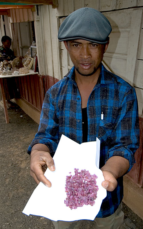 Ambohimandroso ruby rough on offer in the gem market at Antsirabe. Photo: Richard W. Hughes