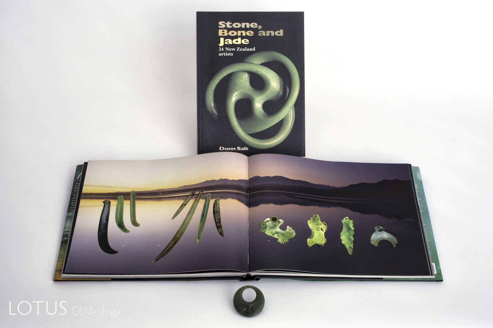 Master carver Donn Salt's book on New Zealand carving sits above a spread from Beck and Mason's lavish 2010 Pounamu: The Jade of New Zealand. In the foreground is an original Donn Salt carving in New Zealand nephrite jade.