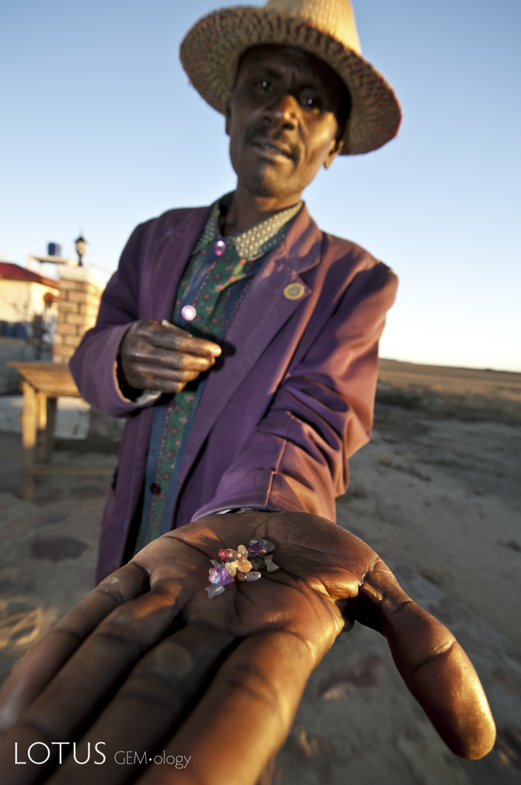 A sapphire trader with his latest offerings at Manombo, near Ilakaka, Madagascar. Photo: R.W. Hughes, 2010. 