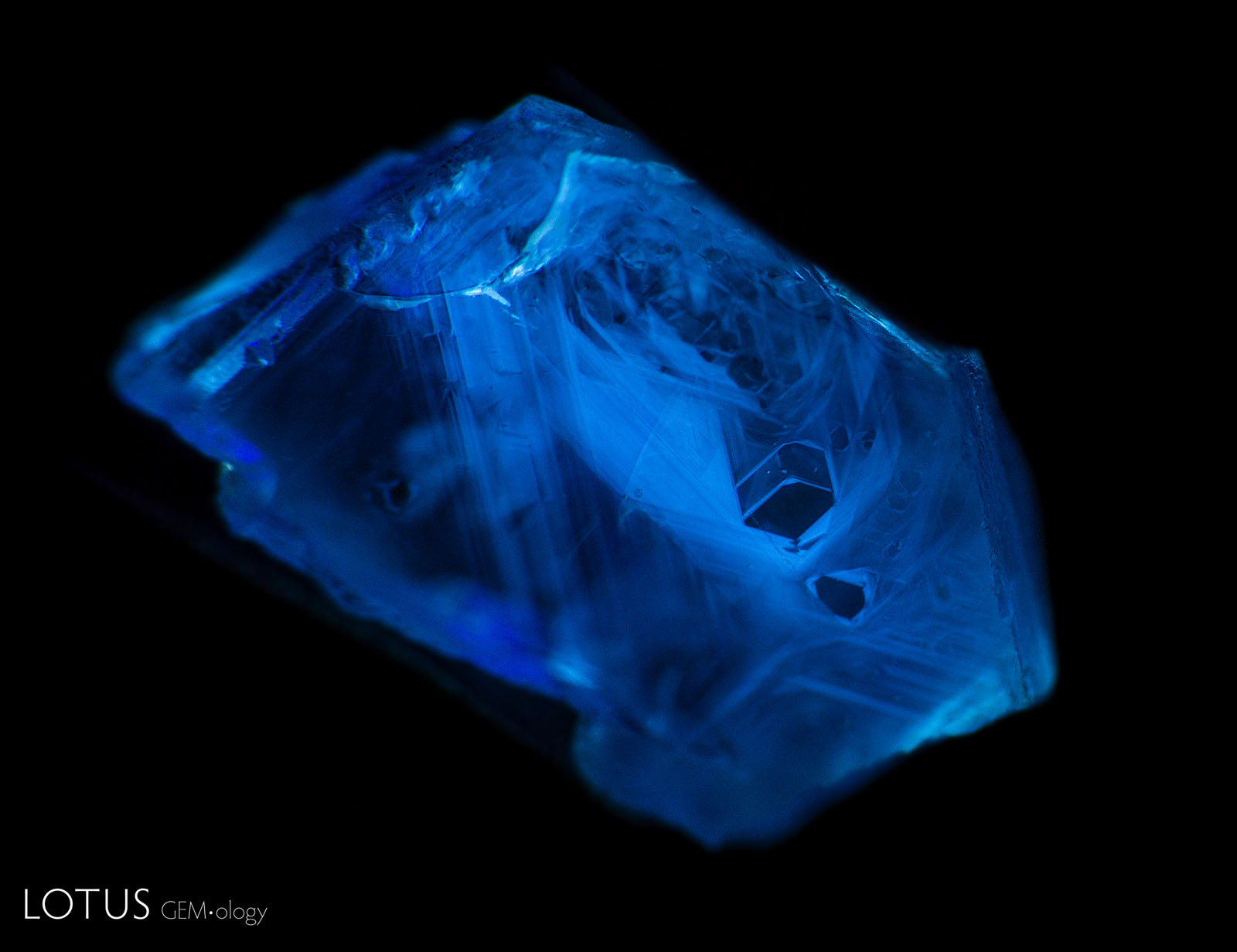 Short-wave UV fluorescence reaction of a Madagascar sapphire during heating Figure 18. Sample 10 did not show any short-wave fluorescence reaction until it was heated to 1000°C. At this point it displayed a strong chalky blue reaction, with complex angular fluorescent zones. Photo by E. Billie Hughes.