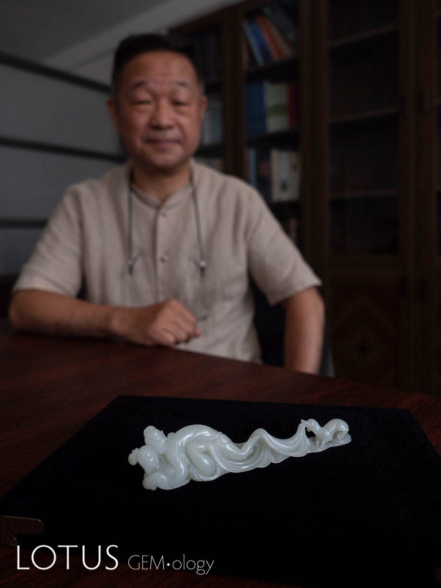 Erotic Pen Holder by Wu Desheng. This carving, which shows a couple's lovemaking interrupted by a dog, is a fantastic example of bringing humor and whimsy into the art form. Hetian "mutton fat" nephrite from Xinjiang, China. 15.2 x 2.3 x 3.3 cm; 2003. Photo: Richard W. Hughes. Click on the photo for a larger image