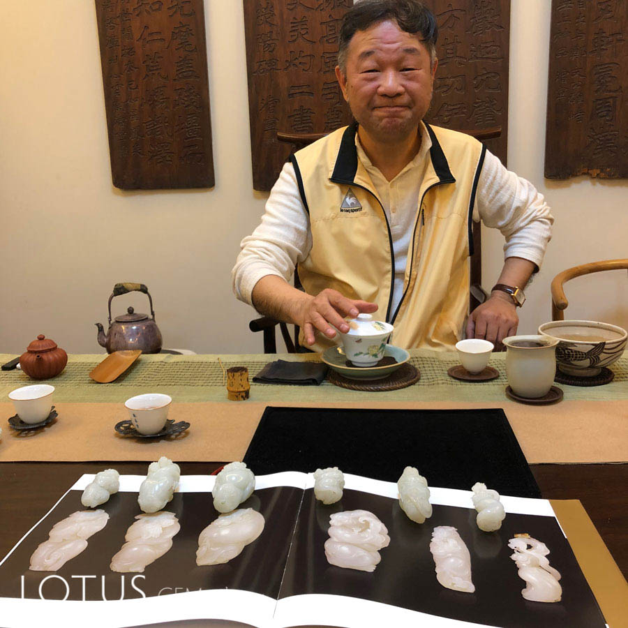 Lin Tze Chuan (Lin Zi Quan) in his Shanghai studio, displaying six carvings by Wu Desheng, featured in the book Extraordinary and Elegant (2007). The twelve zodiac animals corresponding to the twelve terrestrial branches; all the zodiac signs have absorbed elements of Chinese opera and are personalized. Hetian "mutton fat" nephrite from Xinjiang, China. 2007. Photo: E. Billie Hughes. Click on the photo for a larger image