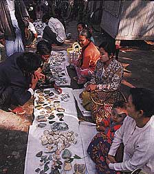 Figure 17. Vendors work the morning jadeite market in Mandalay. Photo © 2000 Fred Ward.