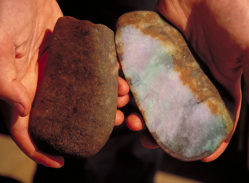 Top left: This jadeite boulder shows the relatively thin skin and potentially good color that is usually associated with "river jade." Although from the outside this appears to be a normal jadeite boulder, oxidants that entered through cracks on the surface have produced a large area of discoloration.