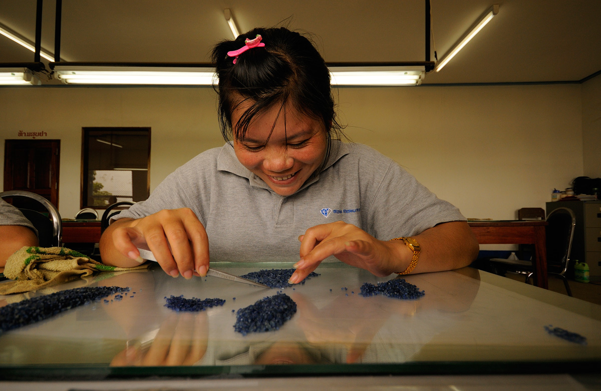 Sorting rough sapphire at SinoRMC’s Huay Xai operation. SinoRMC is one of the largest private employers in Laos’ Bokèo District.