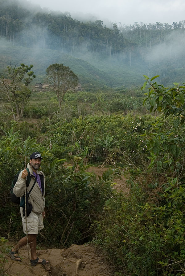 Dana Schorr on the trail to Moramanga a tough and extremely muddy jungle walk from Andilamena. Photo: Richard W. Hughes
