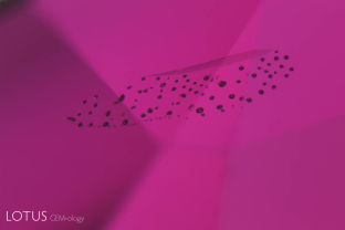 A small heat-altered fingerprint in an unusual, beryllium-treated ruby.