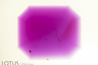 Color zoning with an orange zone in an unusual beryllium-treated ruby.
