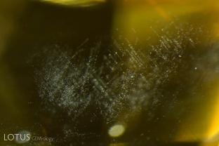 Yellow sapphires from Sri Lanka do not normally contain rutile silk, which is why yellow star sapphires are so rare. Instead they contain tiny, magnesium-bearing particles exsolved in the same pattern as rutile. Care must be taken not to confuse these natural inclusions with the partially-dissolved silk of heat-treated stones.