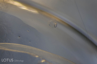 This sapphire crystal from Burma’s Mogok Stone Tract featured extremely large negative crystals with mobile carbon dioxide bubbles. These inclusions would rupture if heated, and so are proof of natural, untreated origin.