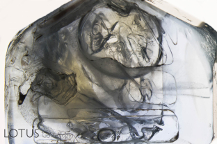 This sapphire crystal from Burma’s Mogok Stone Tract featured extremely large negative crystals with mobile carbon dioxide bubbles. These inclusions would rupture if heated, and so are proof of natural, untreated origin.