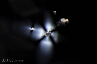 Transparent birefringent crystals with strain patterns enliven the interior of this blue spinel from Mogok, Myanmar.