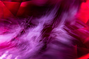 Swirls of exsolved particles light up the interior of this red spinel from Tanzania’s Mahenge region.