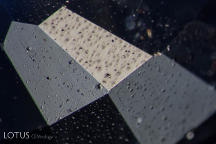 Spall marks from heating on the pavilion of a heat-treated Kashmir (India) sapphire.
