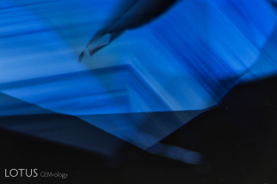 Angular growth zoning with fine texture clouds in transmitted light in a sapphire from Madagascar.
