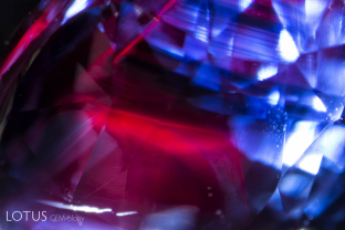 Red fluorescence off of unusual red color zones in a blue sapphire from Sri Lanka.