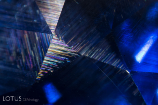 Undissolved rutile silk in a Mogok sapphire. Such silk creates the stars in star sapphire and ruby.