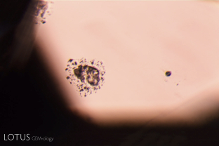 This spinel from Madagascar displayed a number of these inclusions, which consisted of a solid crystal surrounded by a cloud of tiny inclusion.