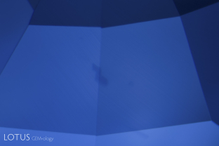 Small angular blue spots just beneath the surface of a Kashmir sapphire. Rough Kashmir sapphires are quite unusual in that they also display these intense blue spots on the surface.