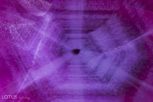 Hexagonally zoned clouds of diaspore silk create a trapiche-like pattern in unheated Mong Hsu (Burma) ruby.