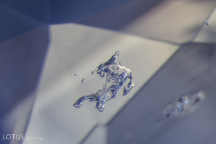 Irregular crystals of what may be feldspar in a sapphire from Madagascar.