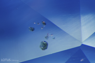 These green crystals were cut through on the surface of this untreated sapphire from Madagascar.