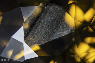 In yellow sapphire from Chanthaburi, Thailand, a thin layer of iron-rich silk is typically found in green layers on the skin of the crystal. After cutting, it is commonly seen just under the table and/or culet.