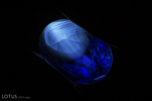 The angular chalky fluorescent patch in this sapphire provides evidence that the stone was heat treated.