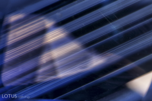 The concept of chromophore cannibalization is clearly illustrated in this photomicrograph of an untreated Madagascar sapphire. When zoned clouds of tiny exsolved inclusions are seen in transmitted light, they are found to be in decolorized areas, while blue areas are cloud free. The reason is that the tiny particles sucked titanium atoms out of solution, “cannibalizing” these potential chromophores.