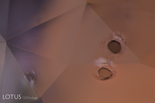 Brown monazite crystals are sometimes found in sapphires from Madagascar’s Ilakaka region. In this gem one can see glassy tension halos around each, indicating that the gem was subjected to low temperature (less than 1400°C) heat treatment.