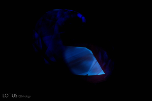 Often chalky shortwave fluorescence is a sign of heat treatment in sapphire, but some stones from Madagascar, like this one, show a superficially chalky patch that is not associated with heat treatment.