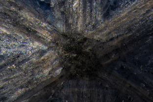 Thin films of liquid light up the interior of a trapiche sapphire.