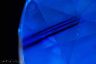 Dark blue color zones such as this surrounded by milky areas are a common feature of Madagascar sapphire from the Ilakaka region; sometimes these stones are confused with those from Kashmir; FOV 5.5 mm