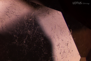 This sapphire was treated with heat at high temperatures, which melted its surfaces, creating the unusual appearance of recrystallized corundum on the surface.
