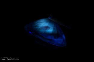 A zoned, chalky appearance in shortwave UV illumination is a sign of heat treatment in sapphire.