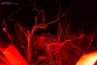 This spinel contained many wispy trails of fine particles, concentrated near the surfaces of the stone.