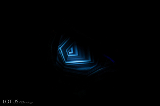 The angular chalky reaction, observable with short wave illumination, provides clear evidence that this blue sapphire was heated.