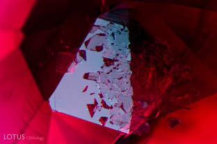 This cluster of crystals, cut through on the surface of this ruby from Mong Hsu, Myanmar, was identified as dolomite with Raman microscopy.
