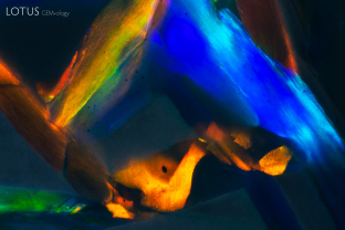 The play-of-color effect can be seen interspersed with grey potch in this opal.