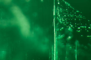 The Emerald City. Fine tubes form a dramatic skyline in this gem.