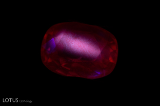 A chalky appearance can be observed in this heated ruby. Note that the chalky areas follow the pattern of silk.