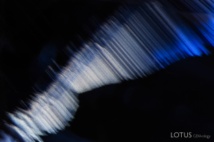 Dense, angular clouds of fine particles cut a striking figure in this heated blue sapphire.