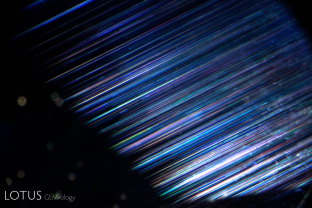 Exsolved rutile silk in Ceylon blue sapphire. The rutile unmixes in three directions at 60/120° in the plane of the basal pinacoid.