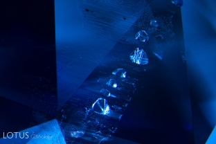 Tiny diaspore needles are seen within negative crystals in this natural Ceylon sapphire.