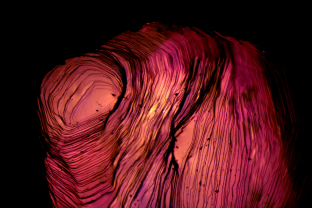 Stepped growth on the surface of a natural ruby crystal from Mogok, Burma.